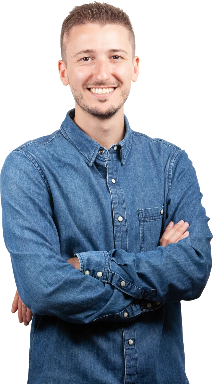 Portrait of Daniel Zhuk, smiling, arms crossed